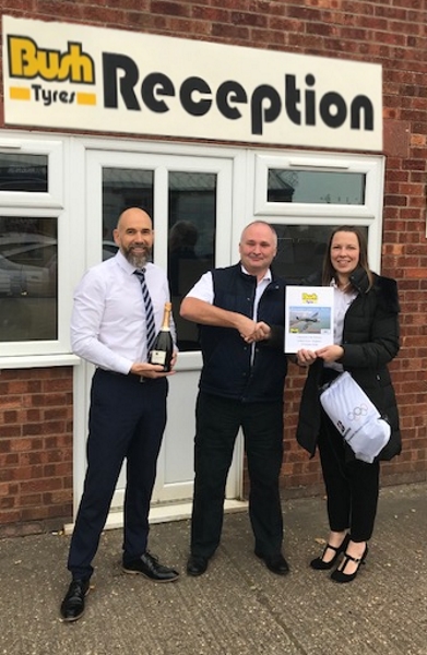 Mr Brain Williams receiving his Spitfire Experience prize from Samantha Allatt (Bridgestone) & Matthew Lincoln (Bush Tyres) at Bush Tyres Skegness Centre